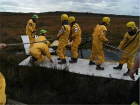 Fig2; Vets practising releasing a horse that has become stuck in a bog