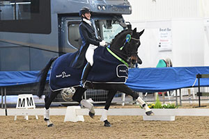 Charlotte Barber Riding Florisou, winners of the Petplan Equine Intermediate I Championship