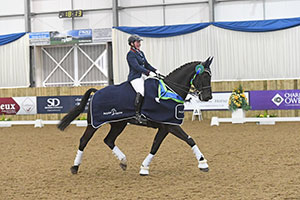 Tyler Bradshaw Riding Dajano, winners of the Petplan Equine Elementary Open Championship